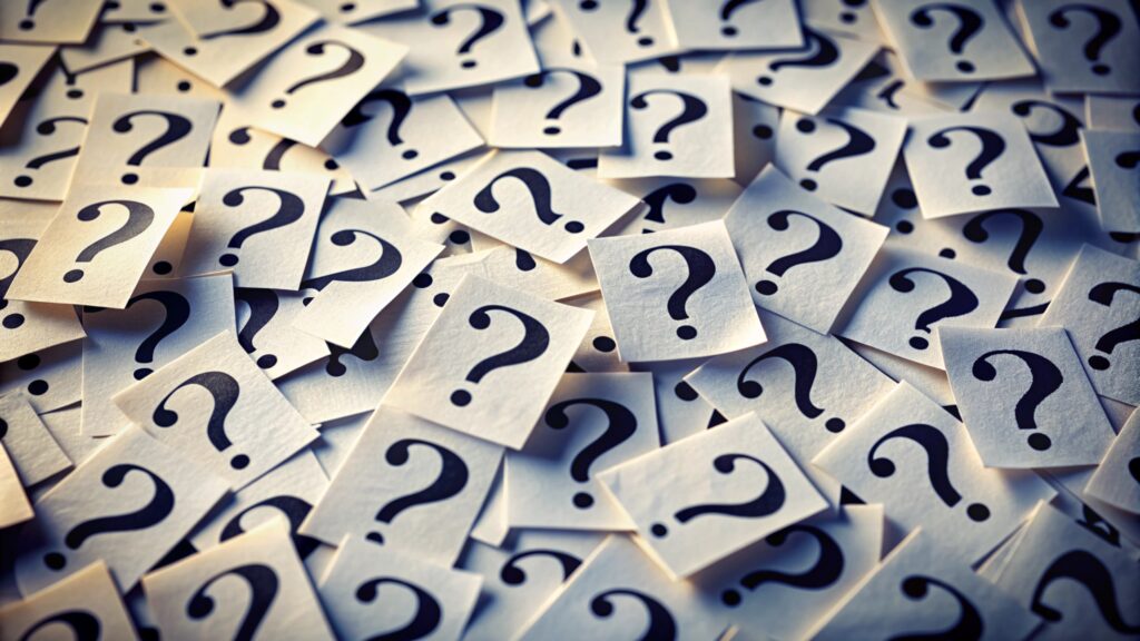 bunch question marks are table with one that says question (1)